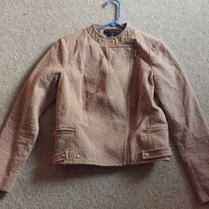 A tan women’s jacket